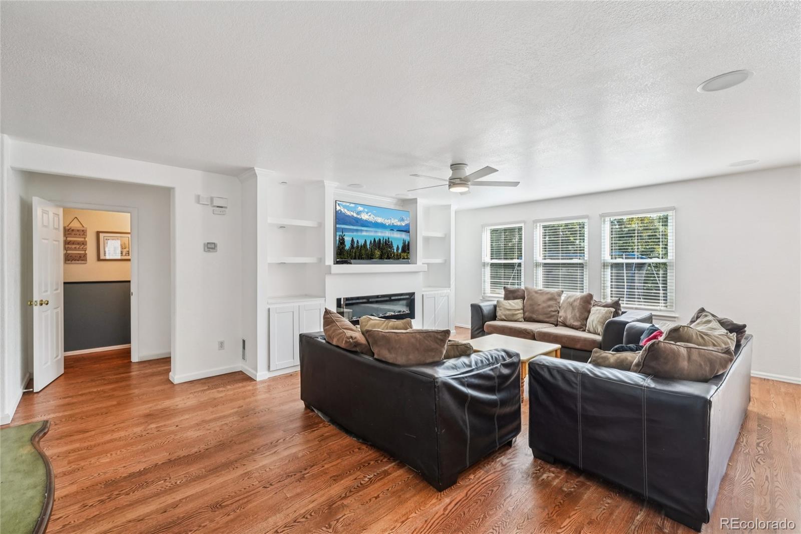 9230 Cook Street Thornton, CO 80229 - Photo 5 of 34 a living room with furniture window and wooden floor