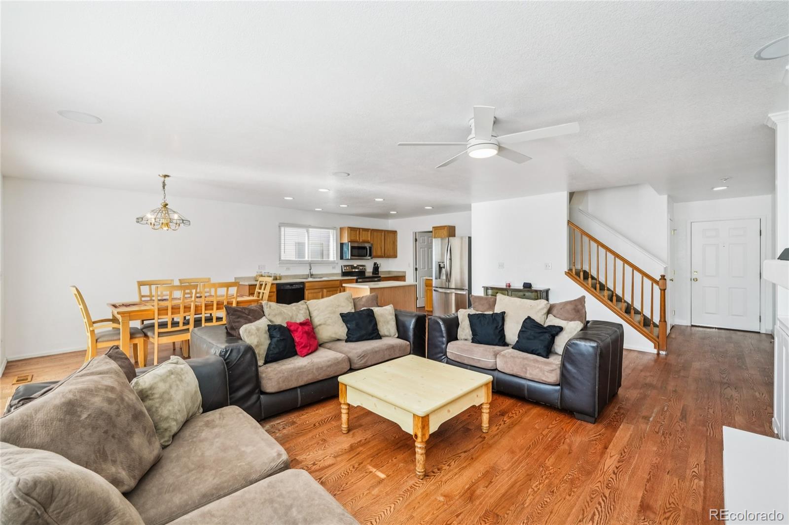 9230 Cook Street Thornton, CO 80229 - Photo 7 of 34 a living room with furniture kitchen view and a couch