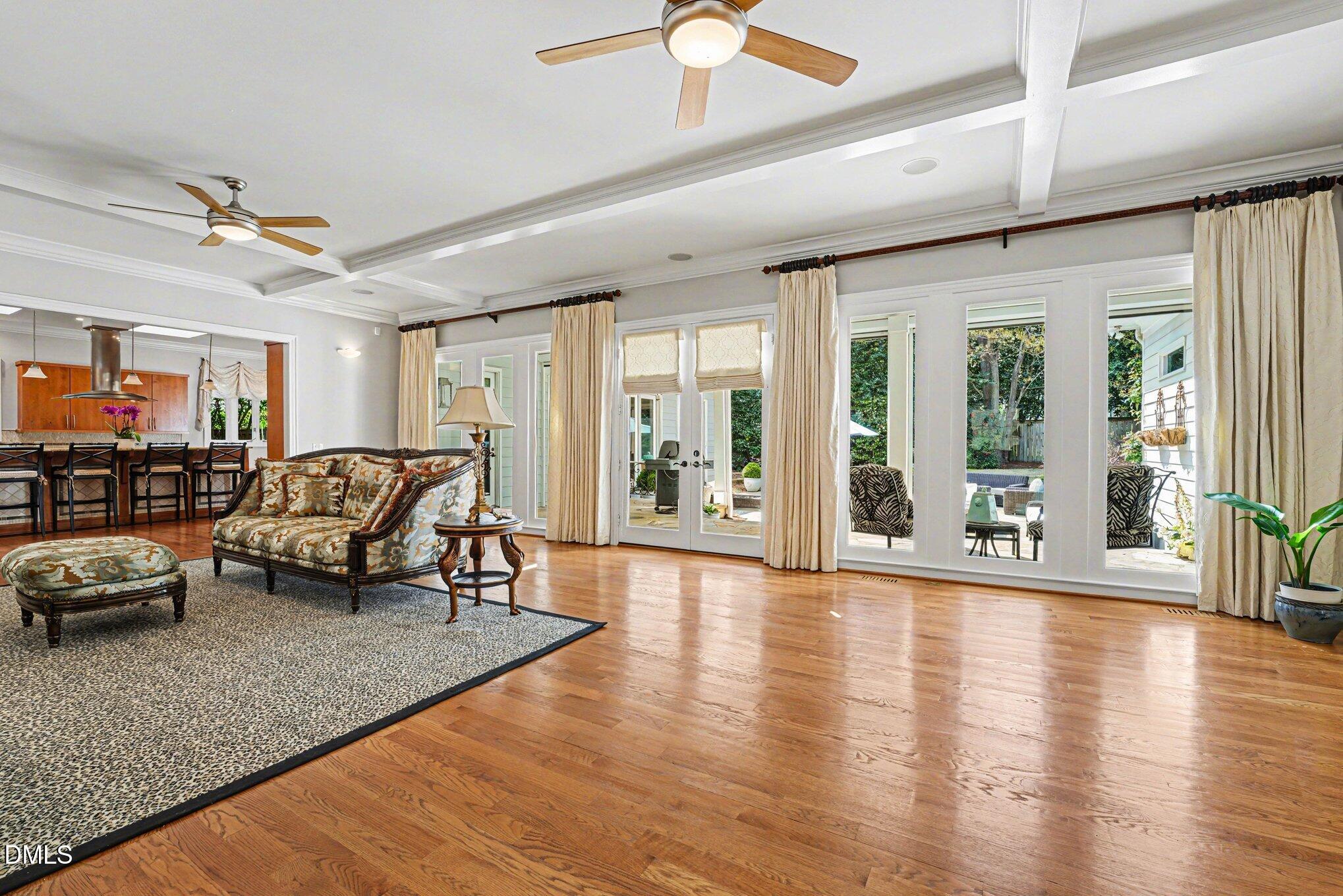3207 Sussex Road Raleigh, NC 27607 - Photo 11 of 53 a living room with furniture and a large window with garden view