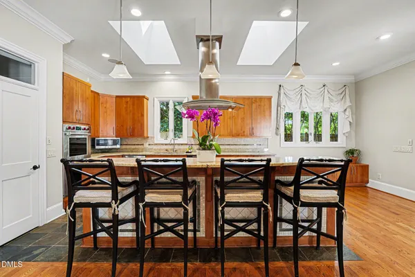 a view of a dining area with furniture and a chandelier