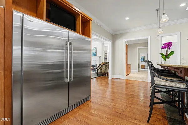 a kitchen with kitchen island a counter top space appliances and cabinets
