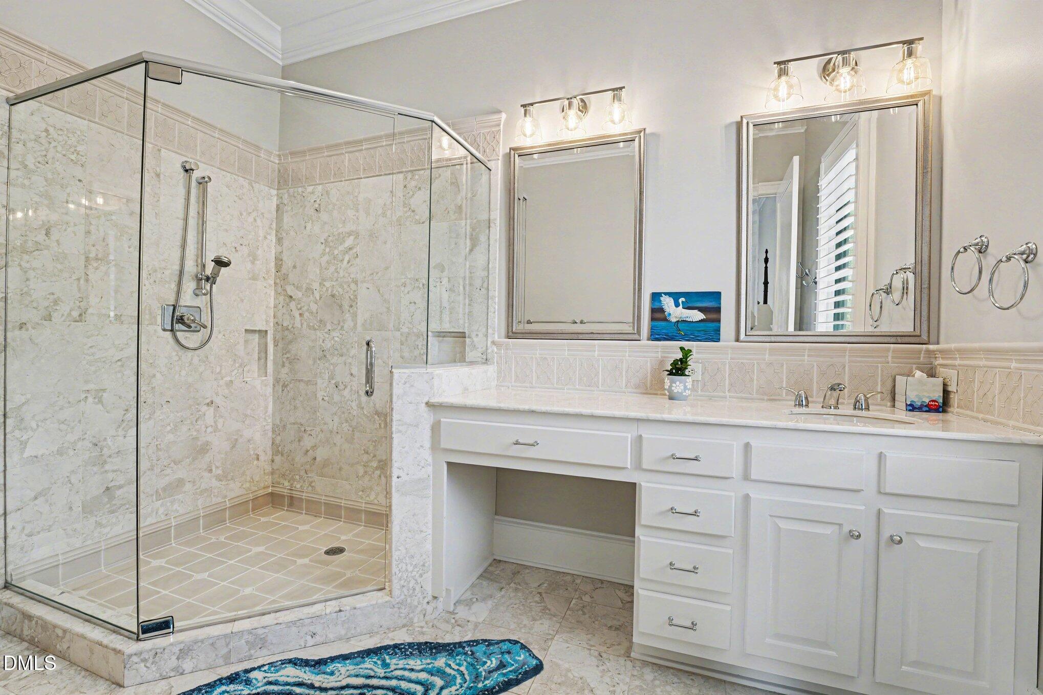 3207 Sussex Road Raleigh, NC 27607 - Photo 20 of 53 a bathroom with a shower sink and mirror