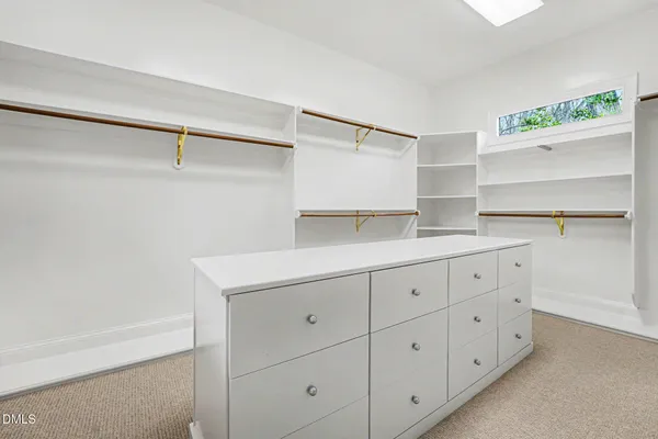 a utility room with cabinets washer and dryer