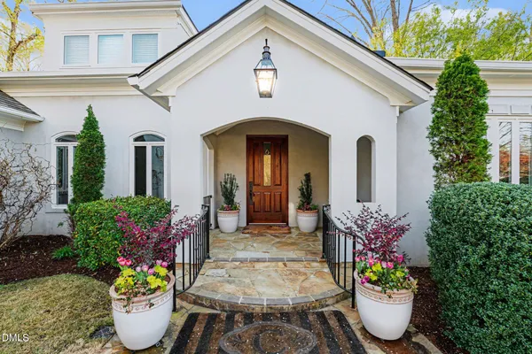 a front view of a house with outdoor seating