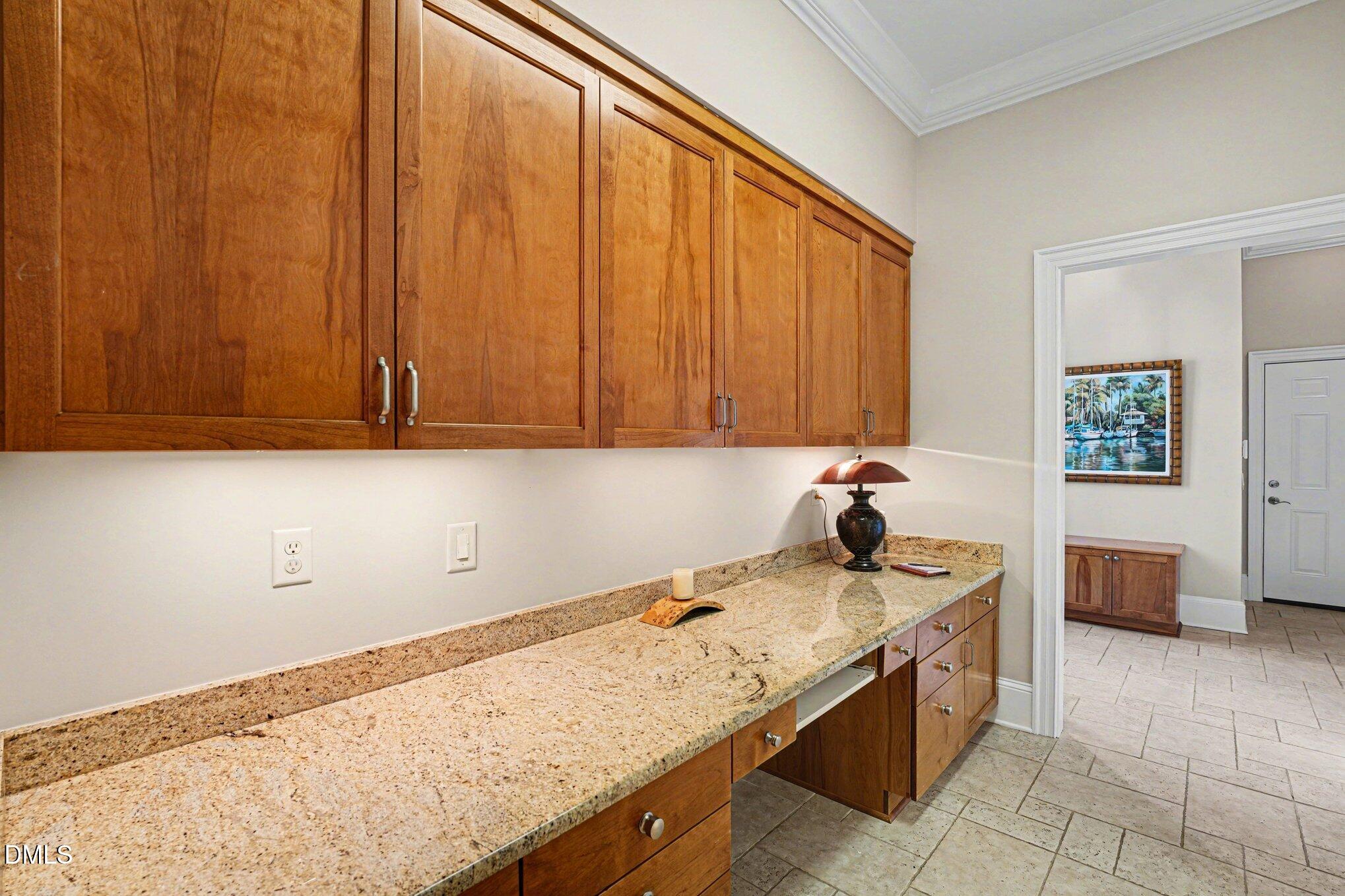 3207 Sussex Road Raleigh, NC 27607 - Photo 31 of 53 a kitchen with a sink and cabinets