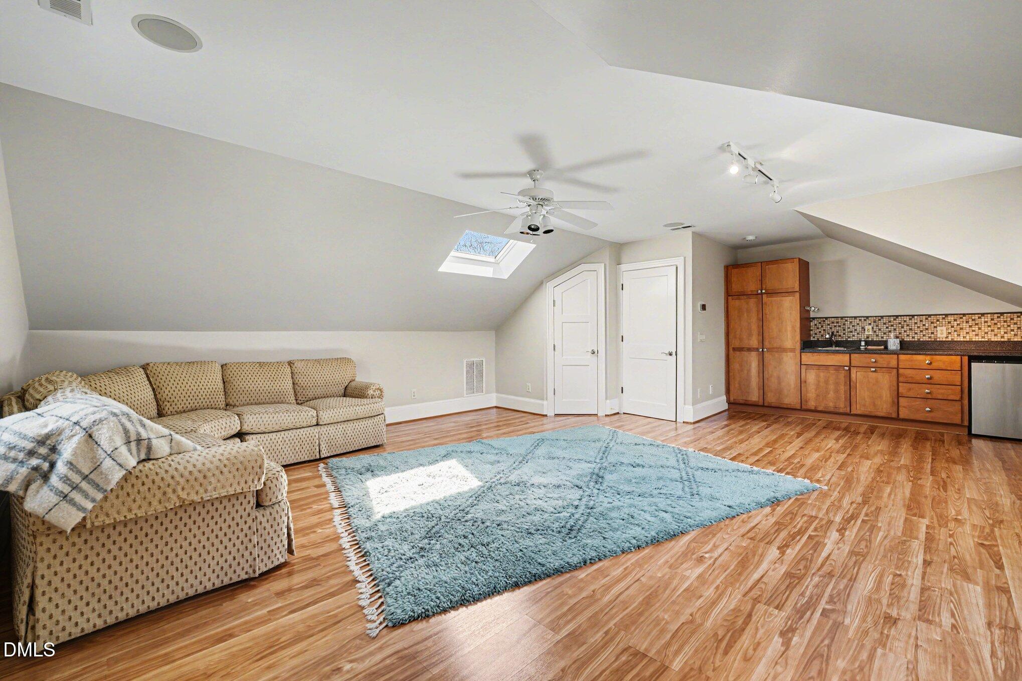 3207 Sussex Road Raleigh, NC 27607 - Photo 35 of 53 a living room with furniture and a kitchen view