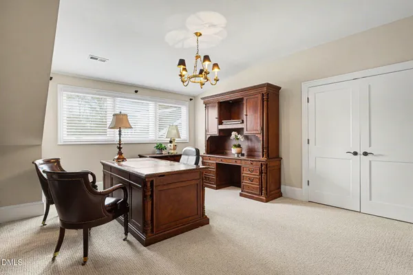 a view of kitchen with furniture and chandelier