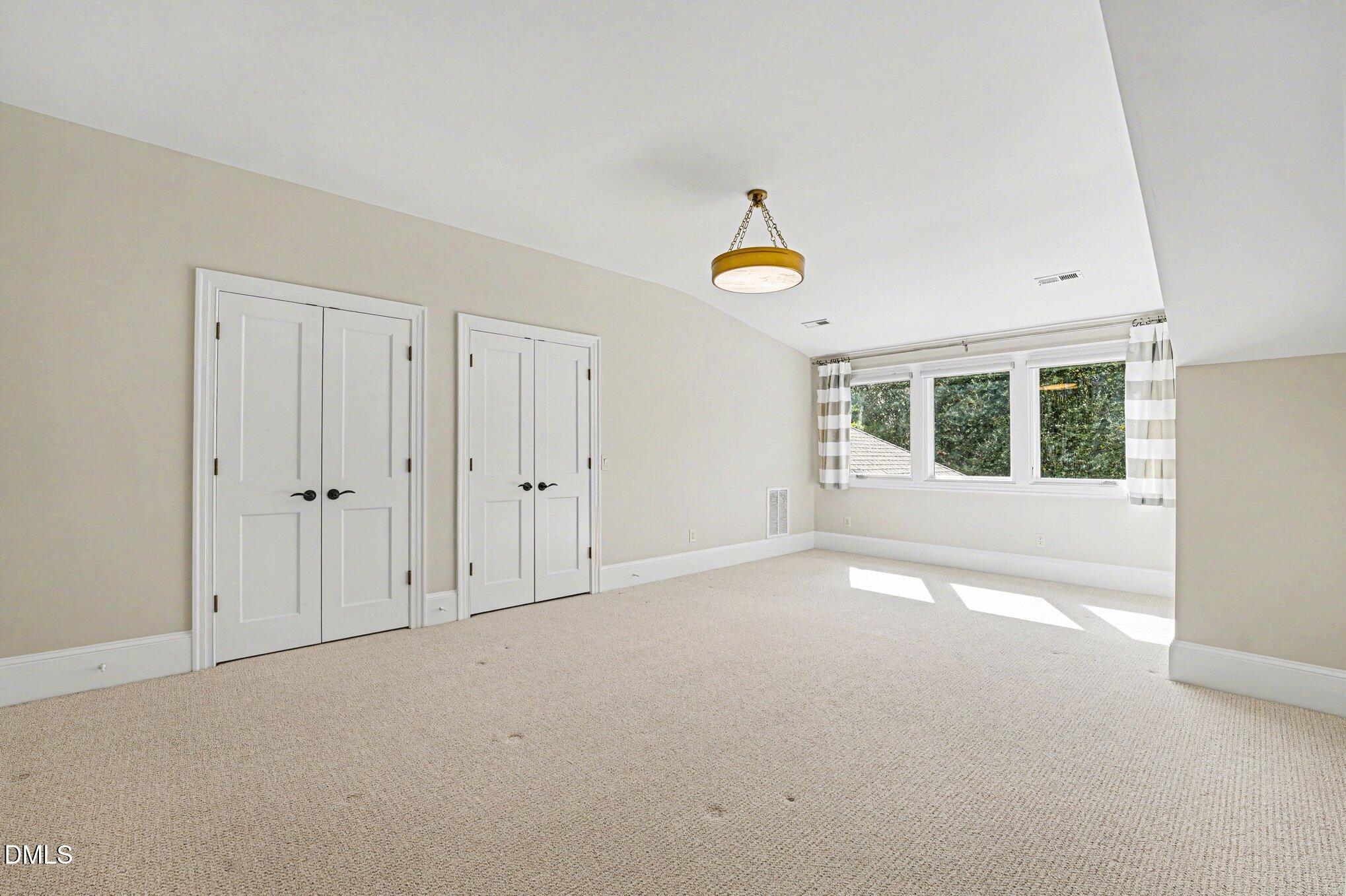 3207 Sussex Road Raleigh, NC 27607 - Photo 40 of 53 a view of an empty room with a window