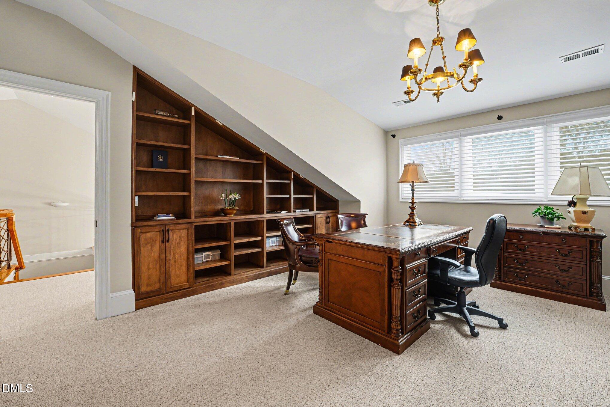 3207 Sussex Road Raleigh, NC 27607 - Photo 42 of 53 a bed room with furniture and a window
