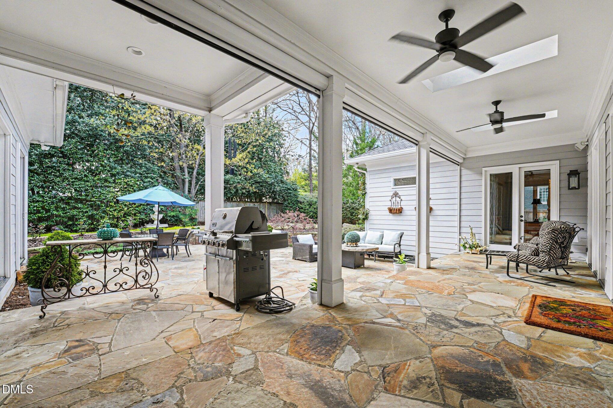 3207 Sussex Road Raleigh, NC 27607 - Photo 44 of 53 a view of a patio with a dining table chairs and backyard