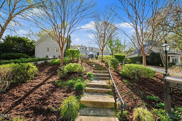 a view of a pathway with a house in the background