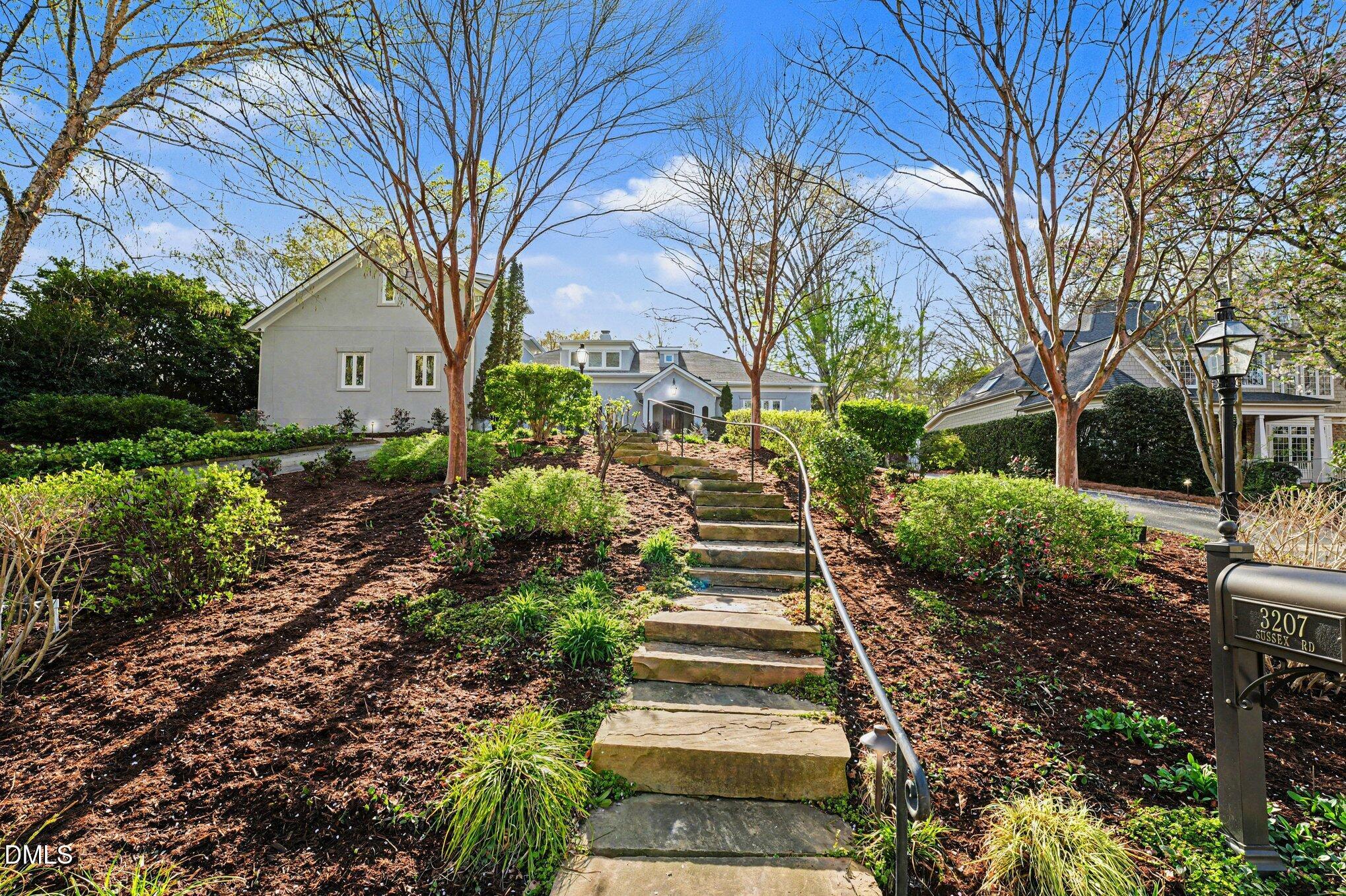 3207 Sussex Road Raleigh, NC 27607 - Photo 50 of 53 a view of a pathway with a house in the background
