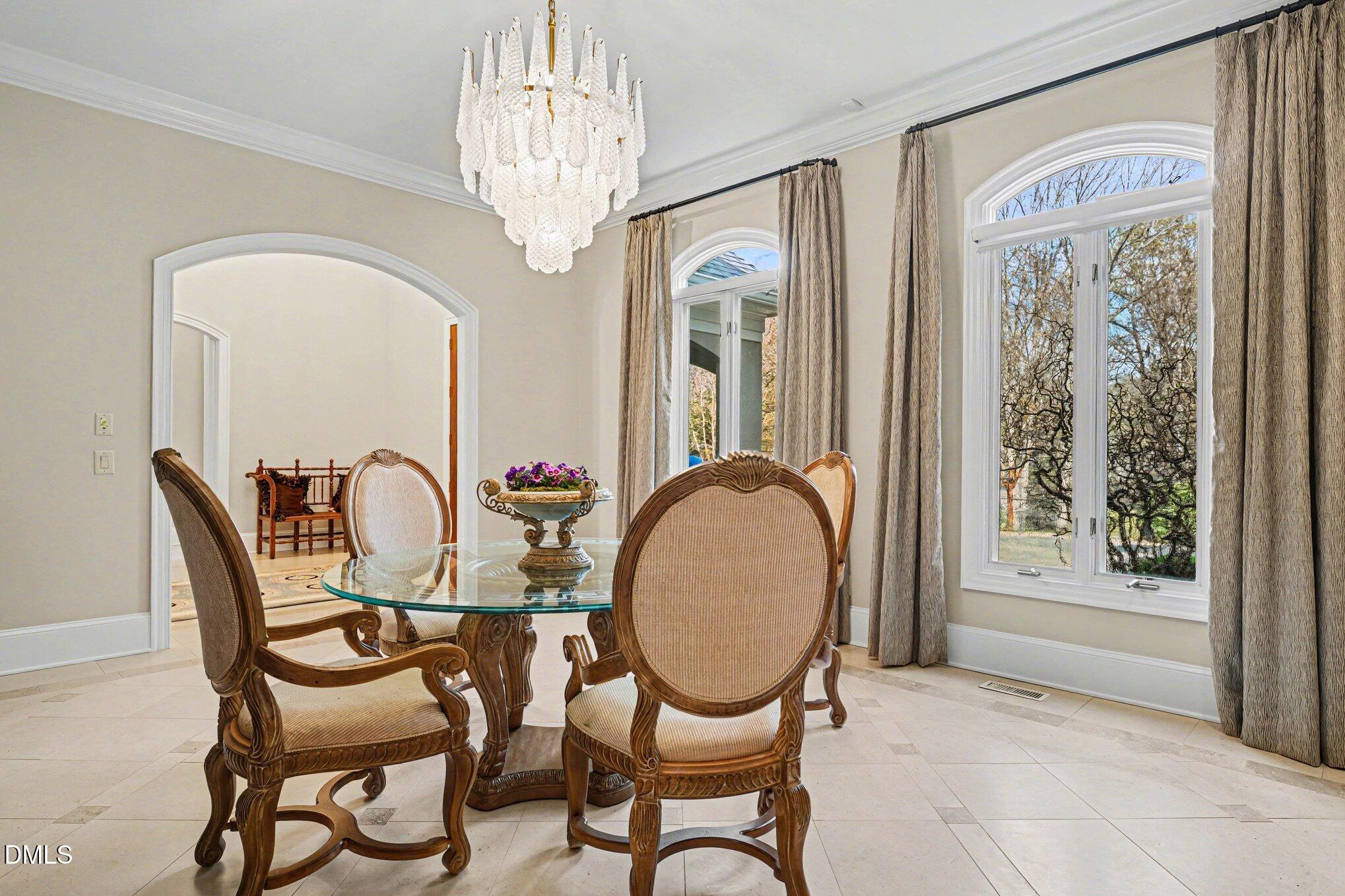 3207 Sussex Road Raleigh, NC 27607 - Photo 6 of 53 a view of a dining room with furniture window and outside view