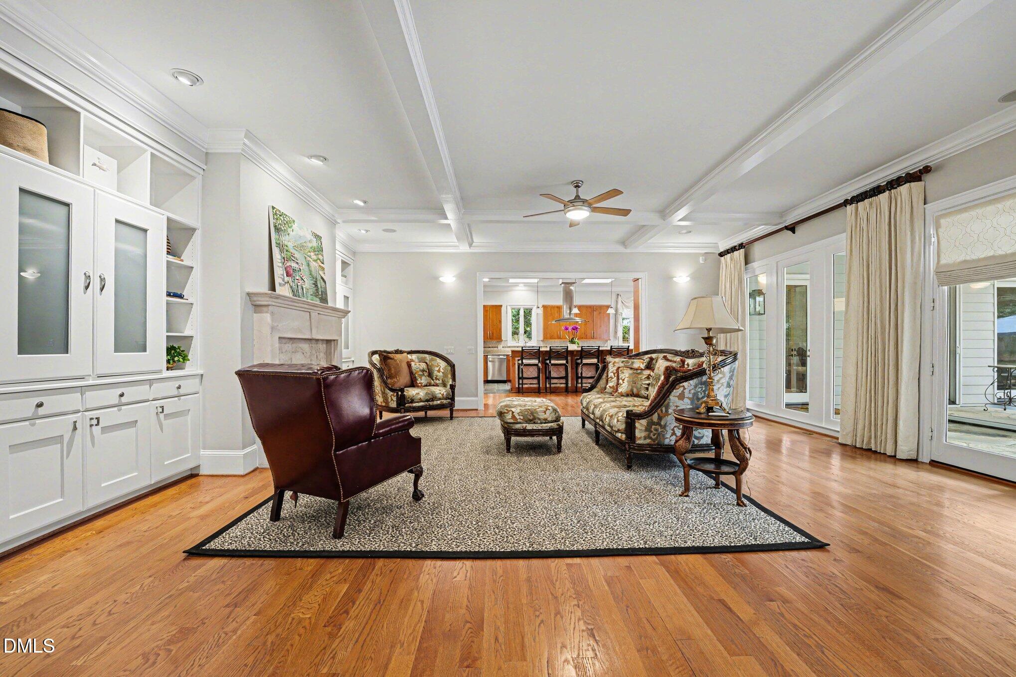 3207 Sussex Road Raleigh, NC 27607 - Photo 10 of 53 a living room with furniture a wooden floor and next to a window
