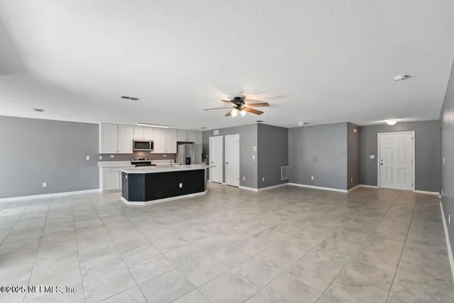 a view of a kitchen with a sink