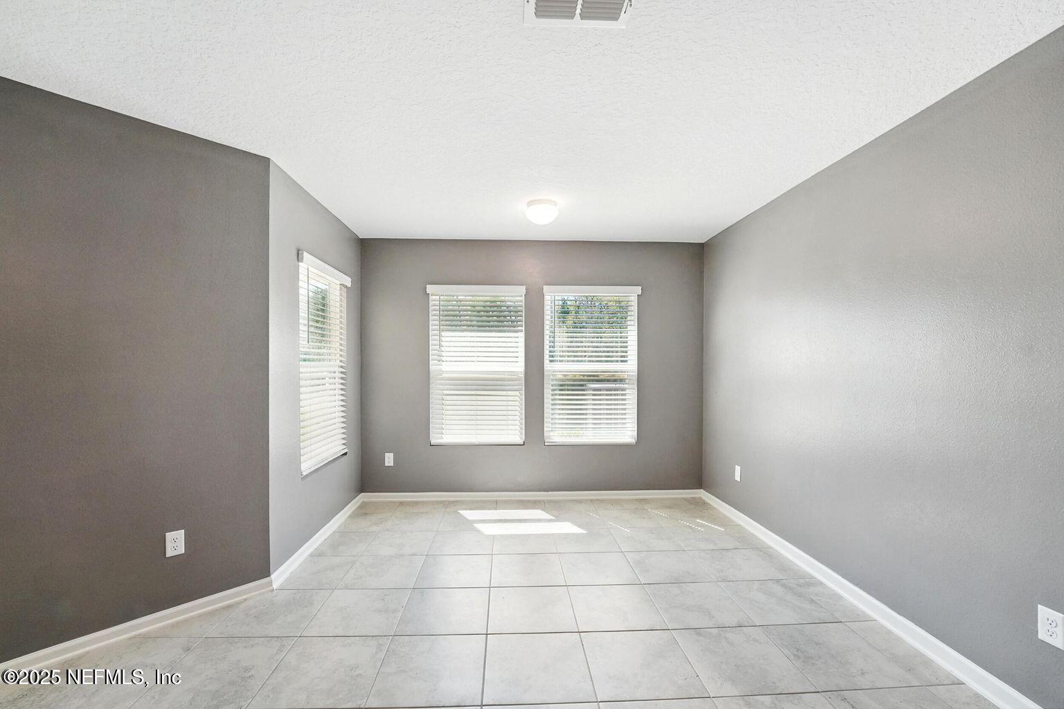 11624 Palladio Way Jacksonville, FL 32218 - Photo 5 of 15 a view of an empty room with a window