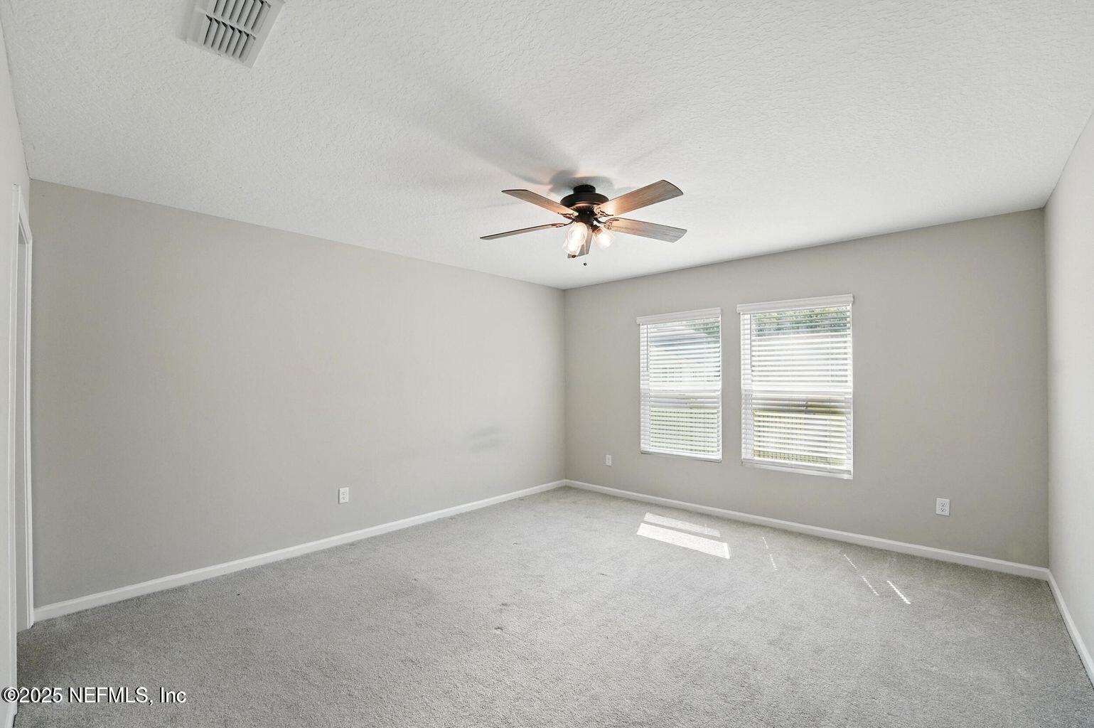 11624 Palladio Way Jacksonville, FL 32218 - Photo 7 of 15 a view of an empty room with a window