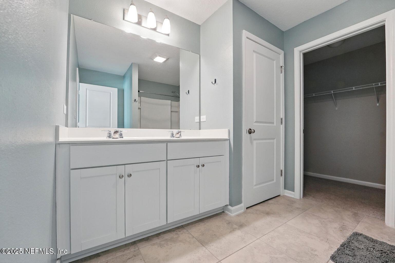 11624 Palladio Way Jacksonville, FL 32218 - Photo 8 of 15 wooden bathroom with a sink and a mirror