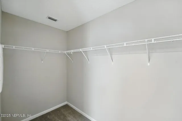 a view of a room with racks on the wall