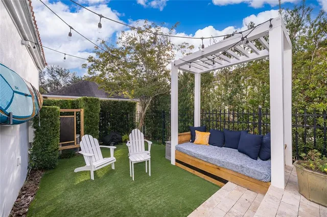 a view of a two chairs in the patio