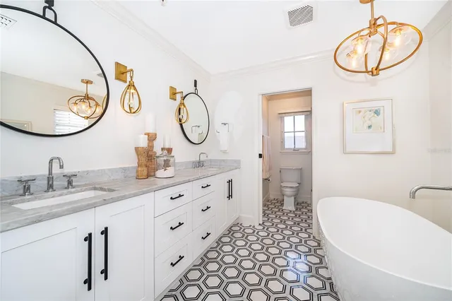 a bathroom with a sink a mirror and a light fixture