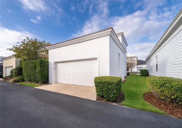 a view of backyard with garage and outdoor seating