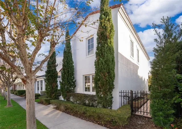 a view of a house with brick walls