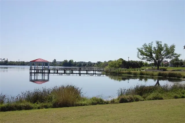 a view of a lake with houses in the background