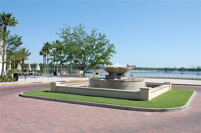 a view of a swimming pool with a yard