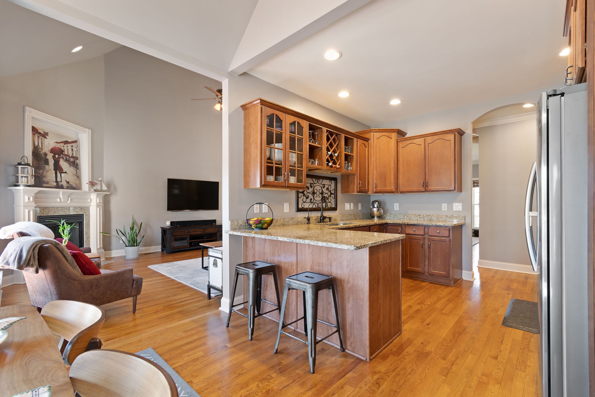 3013 Honeysuckle Drive Spring Hill, TN 37174 - Photo 22 of 55 a living room with stainless steel appliances granite countertop furniture a fireplace a flat screen tv and a window