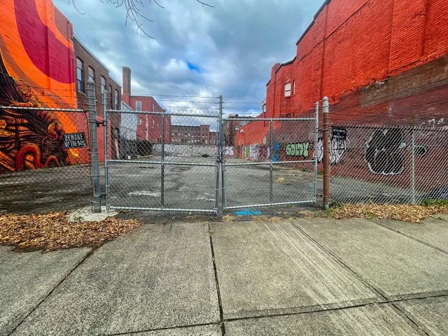 a view of a street with a building in the background