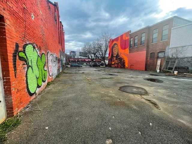 a view of a street with buildings