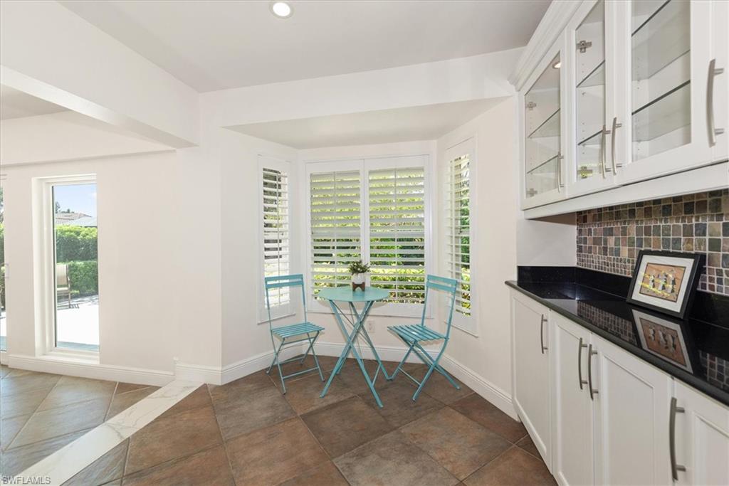 2252 Royal Lane Naples, FL 34112 - Photo 22 of 42 Breakfast dining nook with recessed lighting, tile patterned floors and Plantation shutters