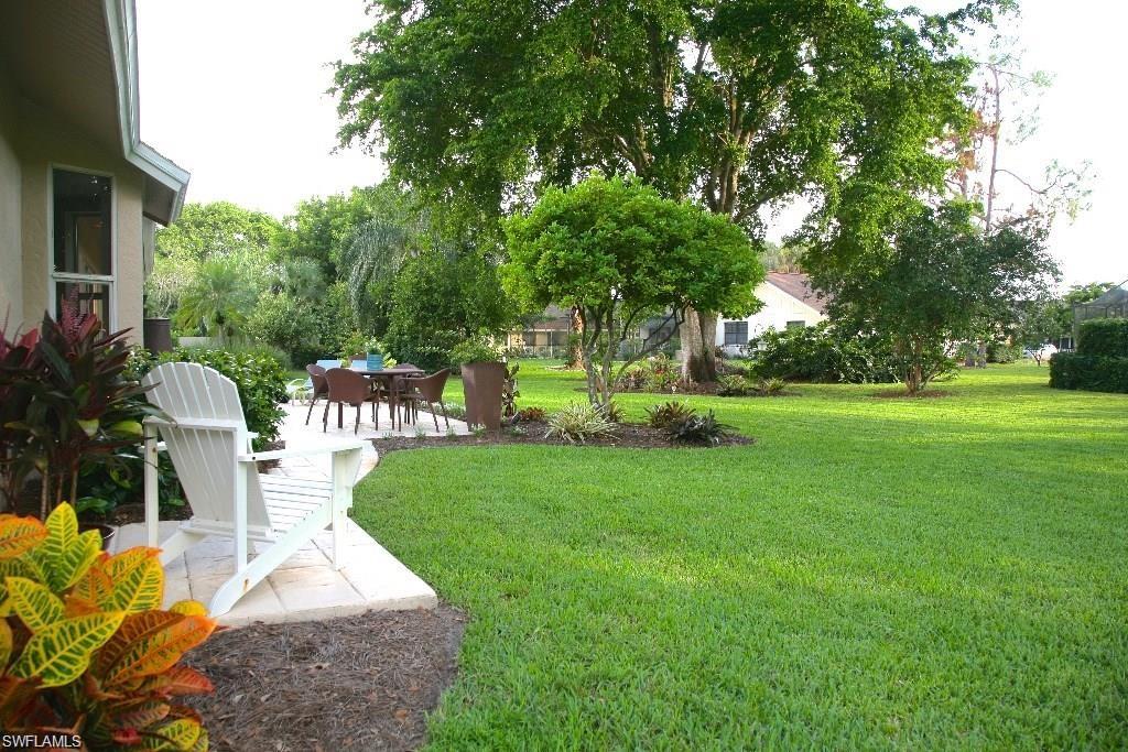 2252 Royal Lane Naples, FL 34112 - Photo 25 of 42 View of grassy yard with a patio. Room for pool
