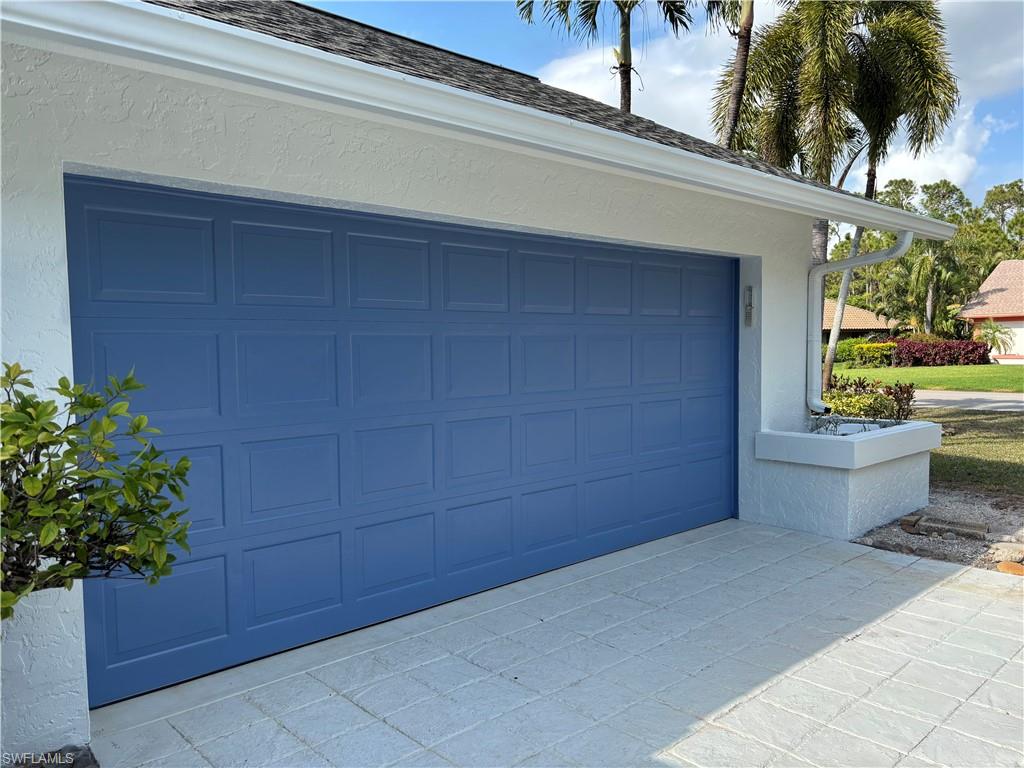 2252 Royal Lane Naples, FL 34112 - Photo 27 of 42 Garage with decorative driveway
