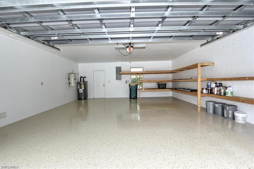 2252 Royal Lane Naples, FL 34112 - Photo 29 of 42 Garage featuring electric water heater and electric panel