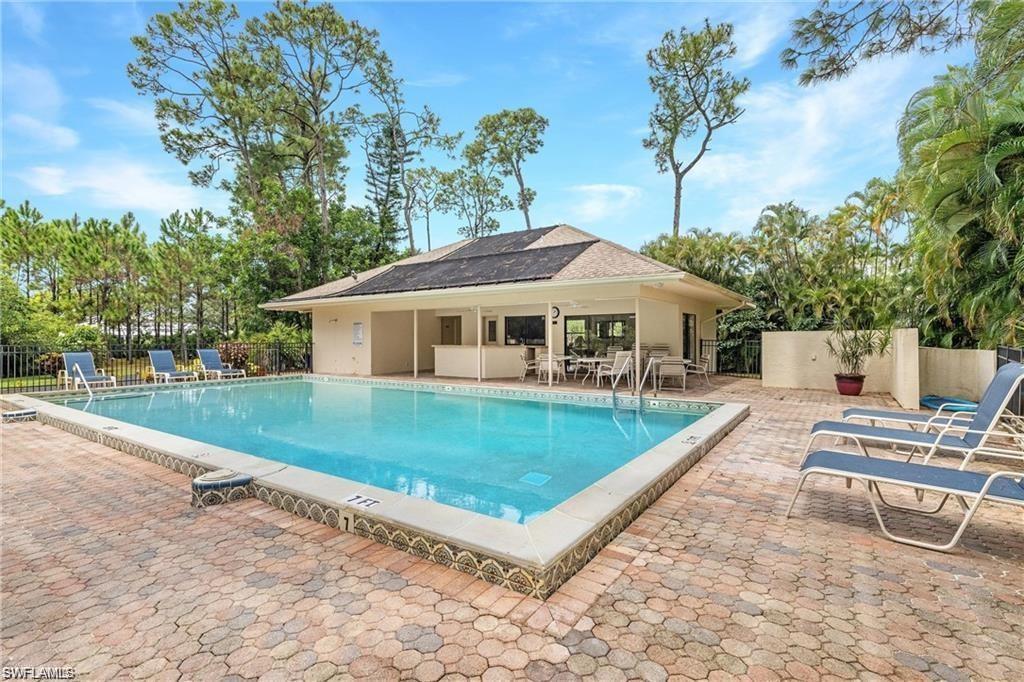 2252 Royal Lane Naples, FL 34112 - Photo 32 of 42 Community pool with a patio area