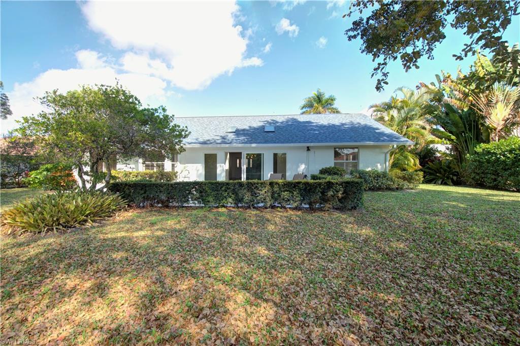 2252 Royal Lane Naples, FL 34112 - Photo 36 of 42 View of back yard with room for pool, NEW roof and gutters and 2 skylights