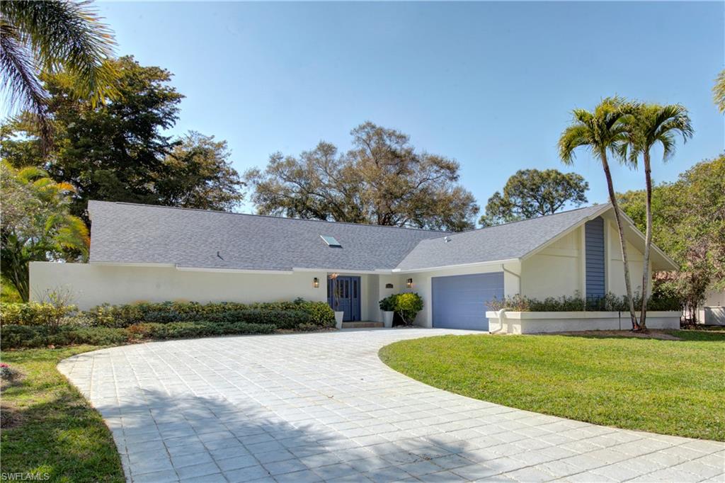 2252 Royal Lane Naples, FL 34112 - Photo 38 of 42 Single story home with front lawn, an attached garage, a NEW shingled roof and gutters and skylight