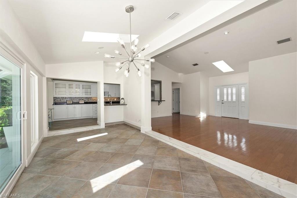 2252 Royal Lane Naples, FL 34112 - Photo 8 of 42 View of Dining room, Living room and Kitchen with vaulted ceilings