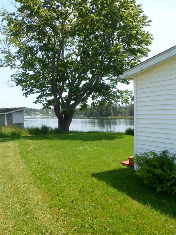 10 Lane's Island Road Vinalhaven, ME 04863 - Photo 2 of 14 Lovely back yard with waterfront on...