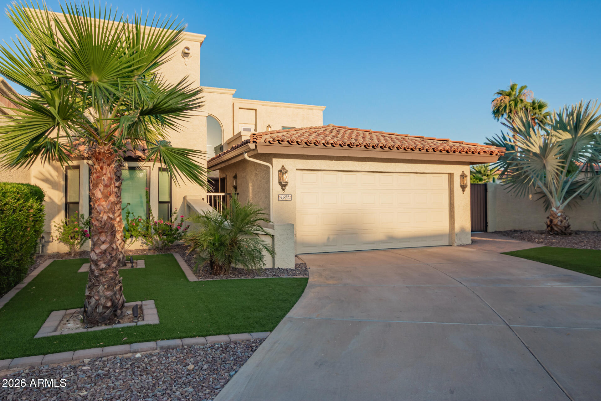 4655 East Monte Way Phoenix, AZ 85044 - Photo 2 of 74 a view of a house with a yard and potted plants