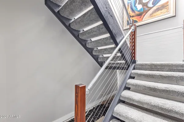 a en suite bathroom with a granite countertop sink a toilet and bathtub