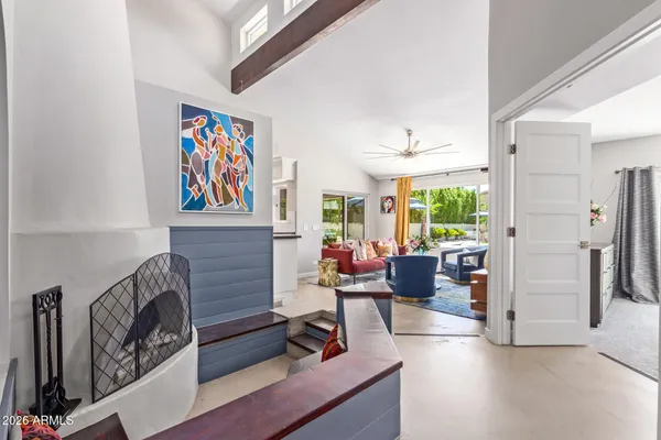 a living room with furniture and a potted plant