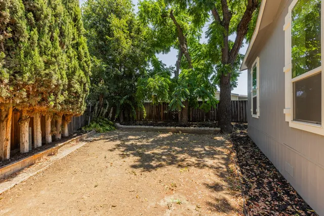 a backyard of a house with lots of green space