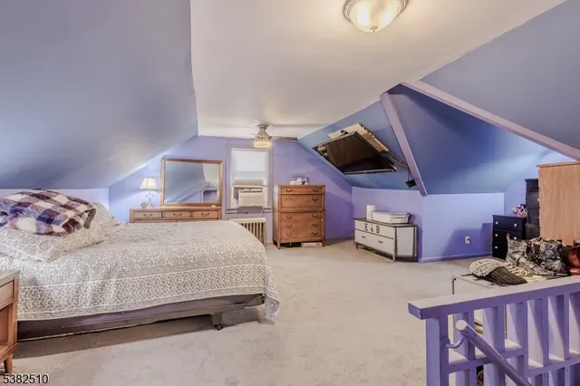 a bedroom with a bed and a walk in closet