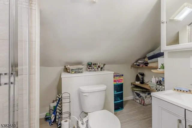 a white toilet sitting next to a bathroom sink