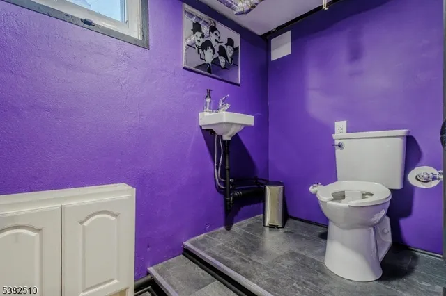a bathroom with a toilet and a sink