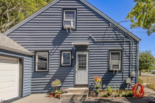a view of a two chairs in the balcony
