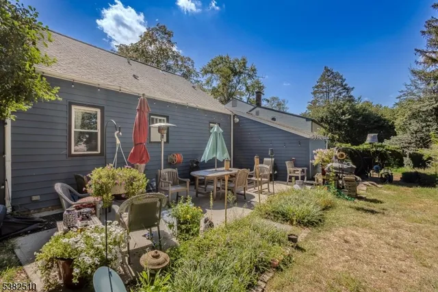 a view of a house with patio outdoor seating